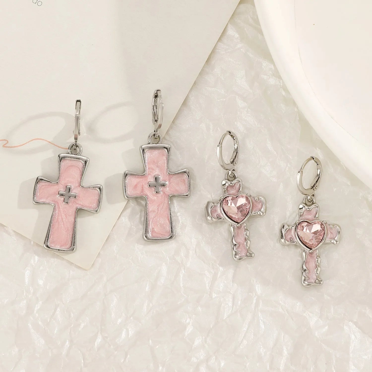 Women's alloy cross crystal earrings in white, bright black, and antique silver colours with geometric animal designs