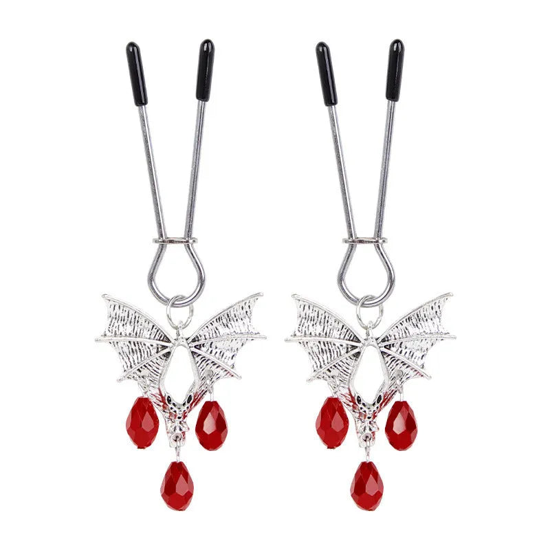 Silver alloy diamond bat nipple clamp set with ruby clip details and adjustable tension mechanism