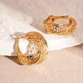 Women's twisted round geometric hollow stud earrings in silver or gold electroplated finish.