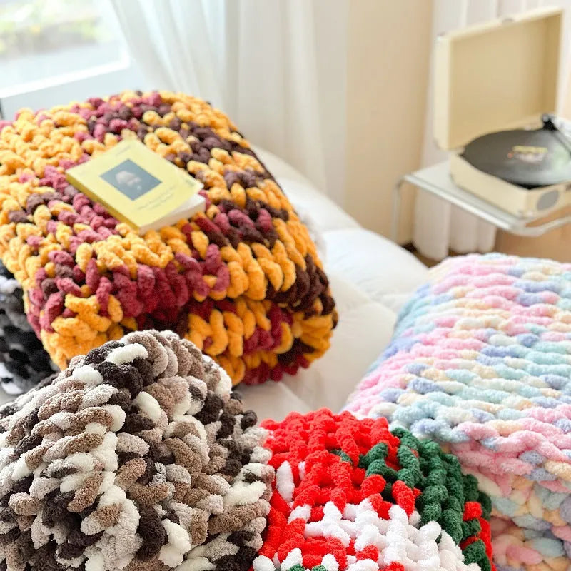 Thick striped chenille handmade blanket in a choice of four colours, shown on a double bed.