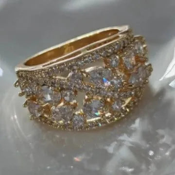 Women's round hollow ring in gold or platinum with sapphire blue or diamond settings