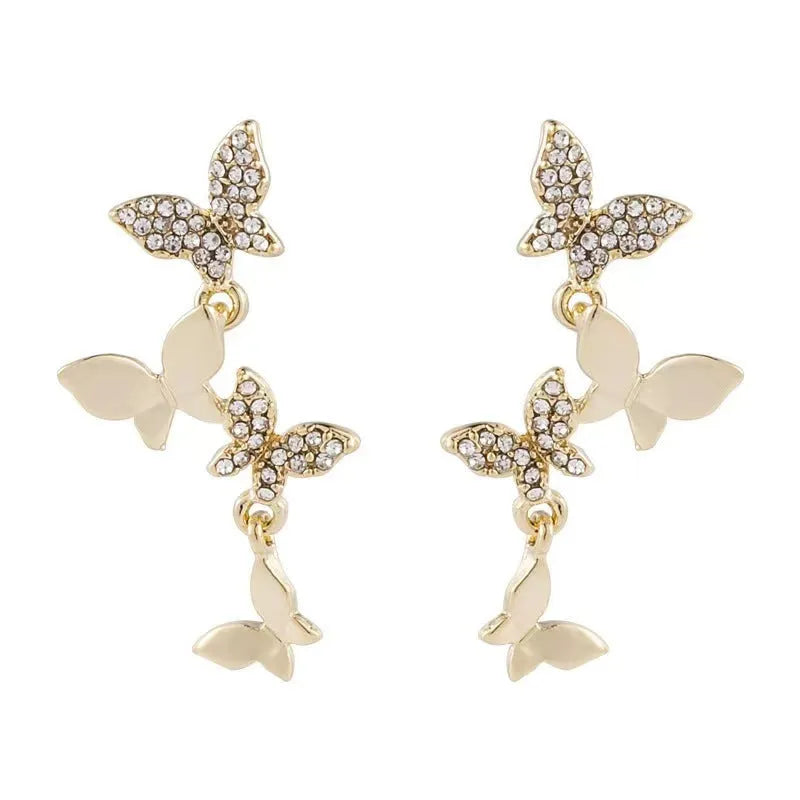 Women's copper butterfly earrings with four butterfly design in gold tone drop style