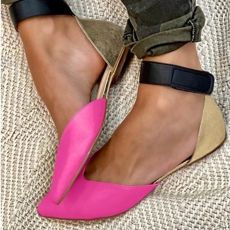 Women's beige hollowed sandals with adjustable velcro straps, shown from the side.