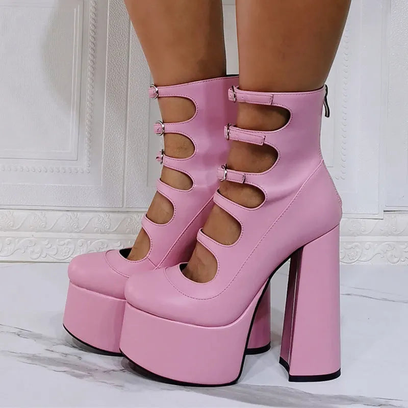 Women's black patent leather platform high heel boots with a thick heel, round toe, and serpentine ankle buckle.