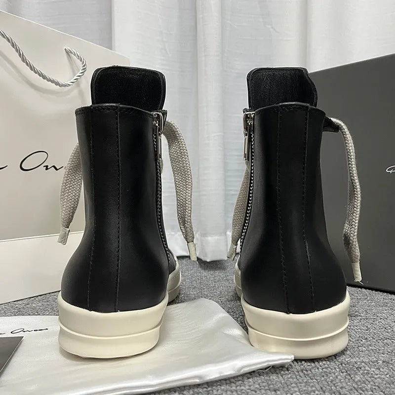 Black high-top leather boots with side zip and platform sole for men and women