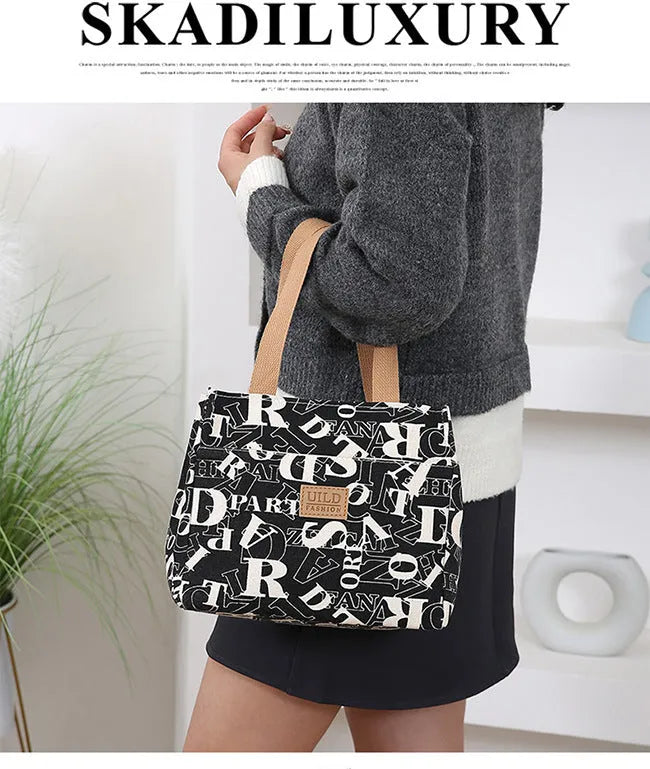 Women's printed canvas shoulder bag with aluminium frame in horizontal square shape
