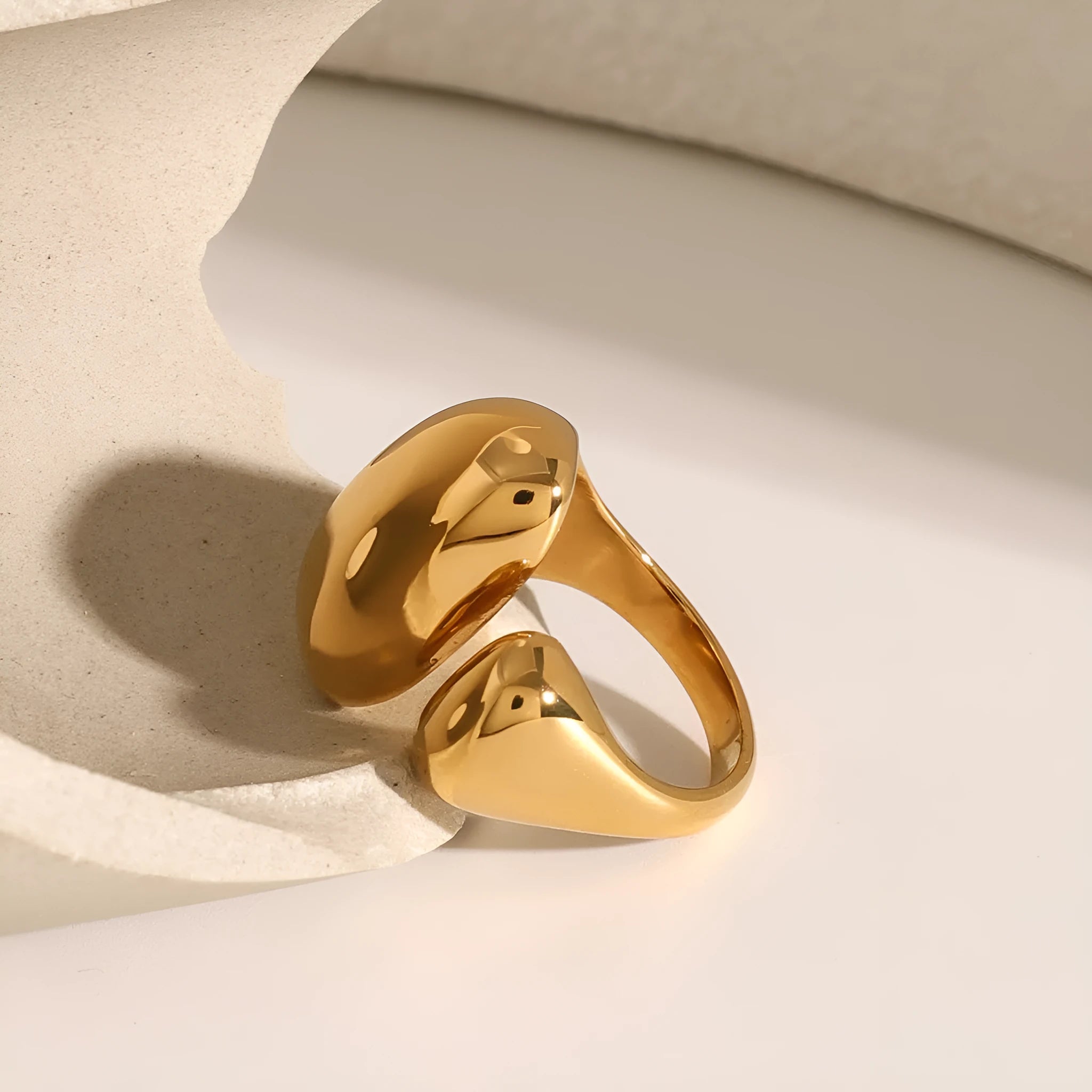 Women's exaggerated open geometric ring in stainless steel with electroplated finish.