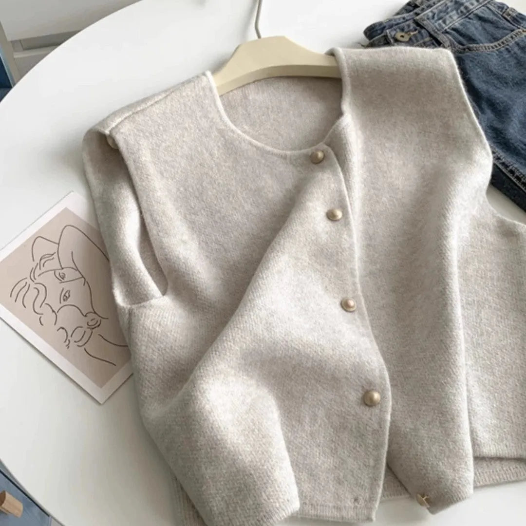 Women's grey V-neck polyester pullover vest with half-length sleeves laid flat