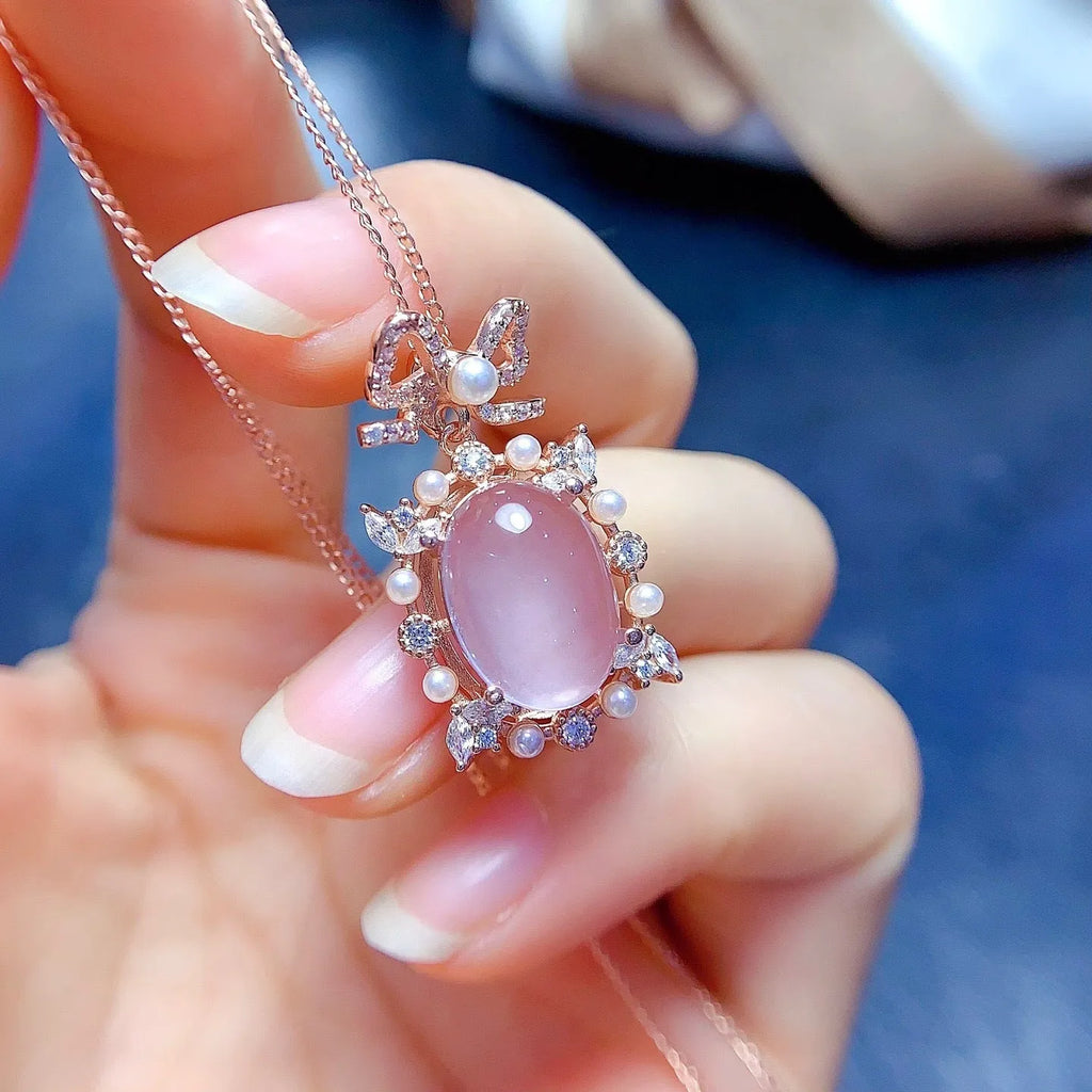 Geometric pendant necklace with pink rose quartz, silver chain, and rose gold plating