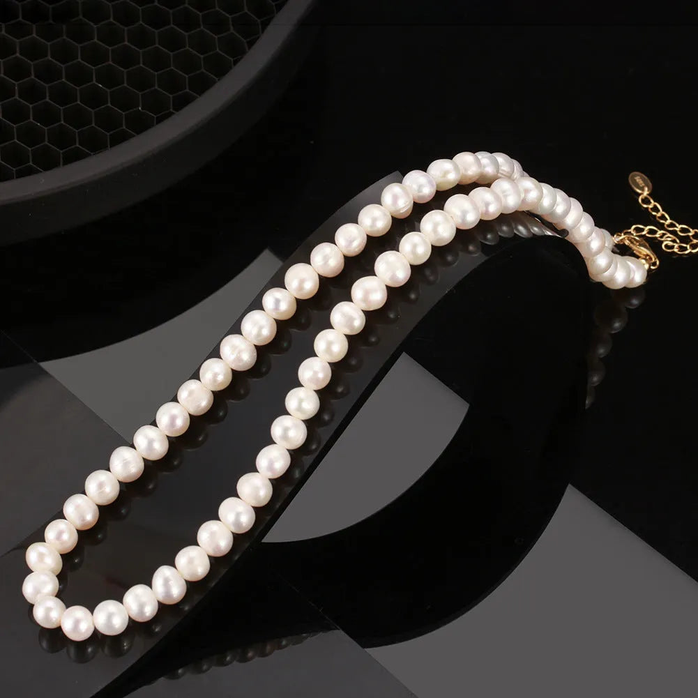Women's adjustable necklace with 6-7mm natural freshwater pearls on a 925 sterling silver chain.
