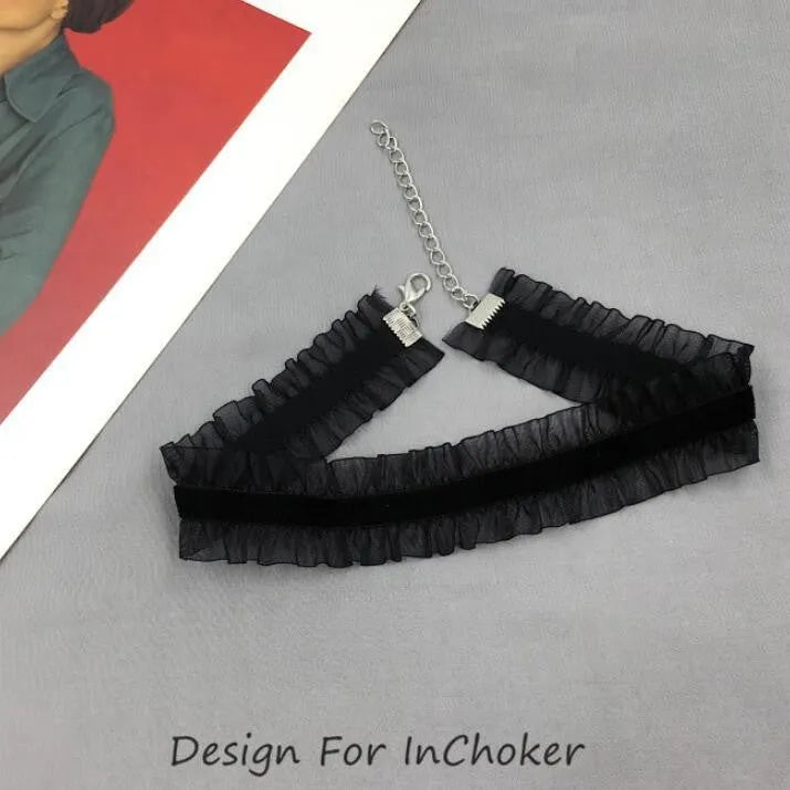 Close-up of an alloy floral pendant necklace with a velvet ruffle texture on an adjustable snake bones chain.