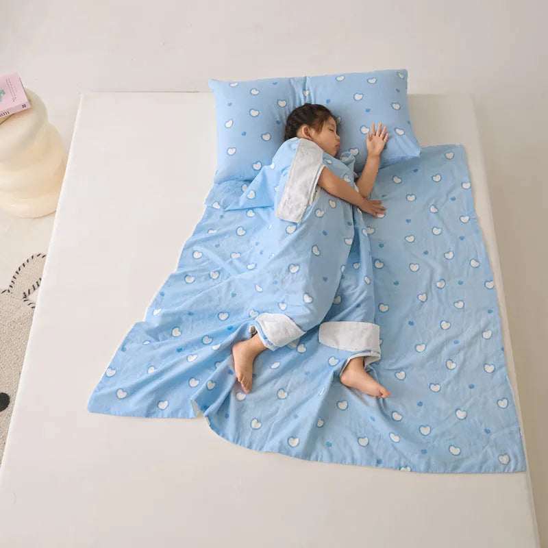 Anti-kick sleeping bag blanket in a colourful Cloud Bear Star Dream design on a bed.