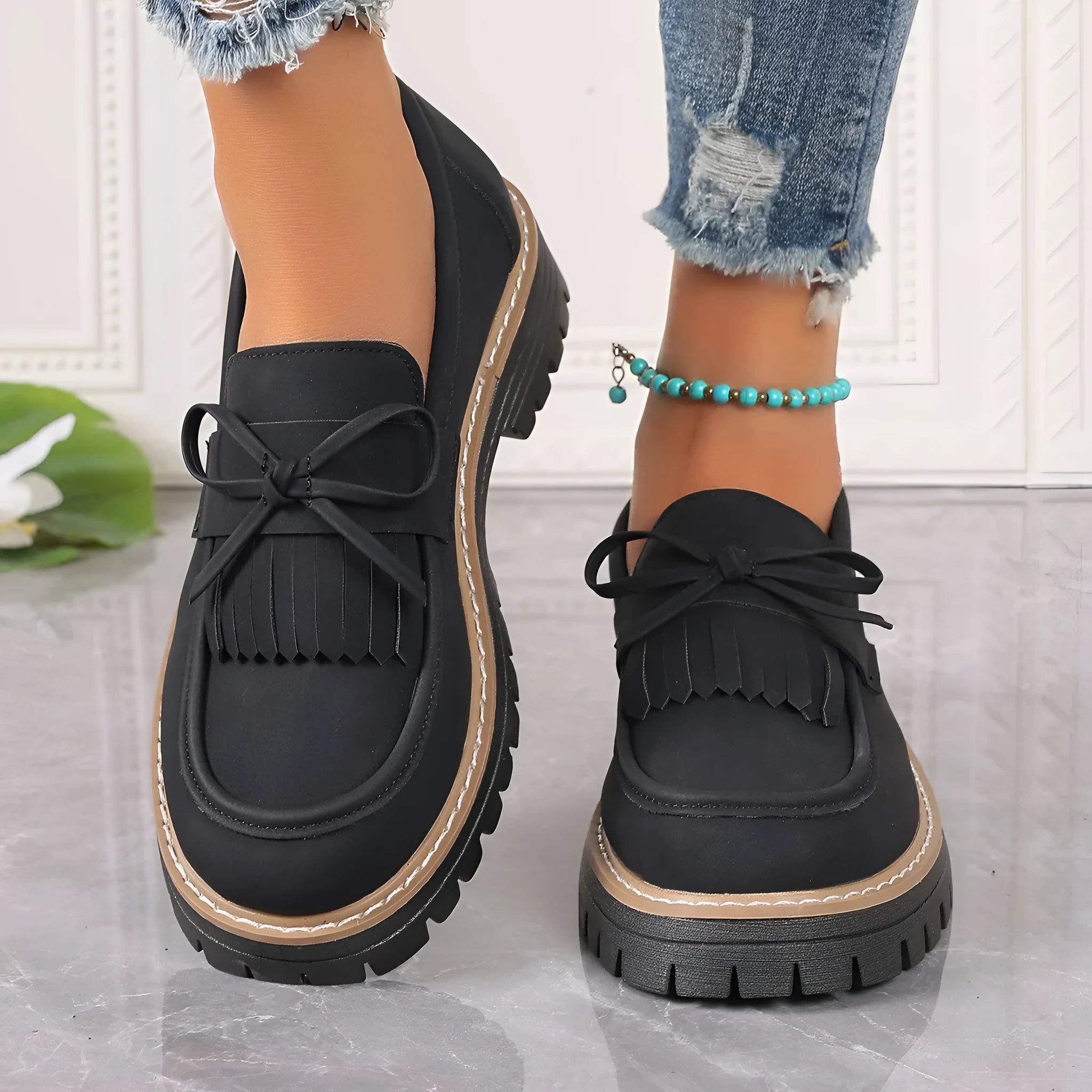 Plus size women's loafers with tassel bowknot detail in black or brown colours with chunky rubber sole