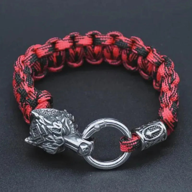 Handmade titanium steel wolf head bracelet in camouflage colour on wrist.