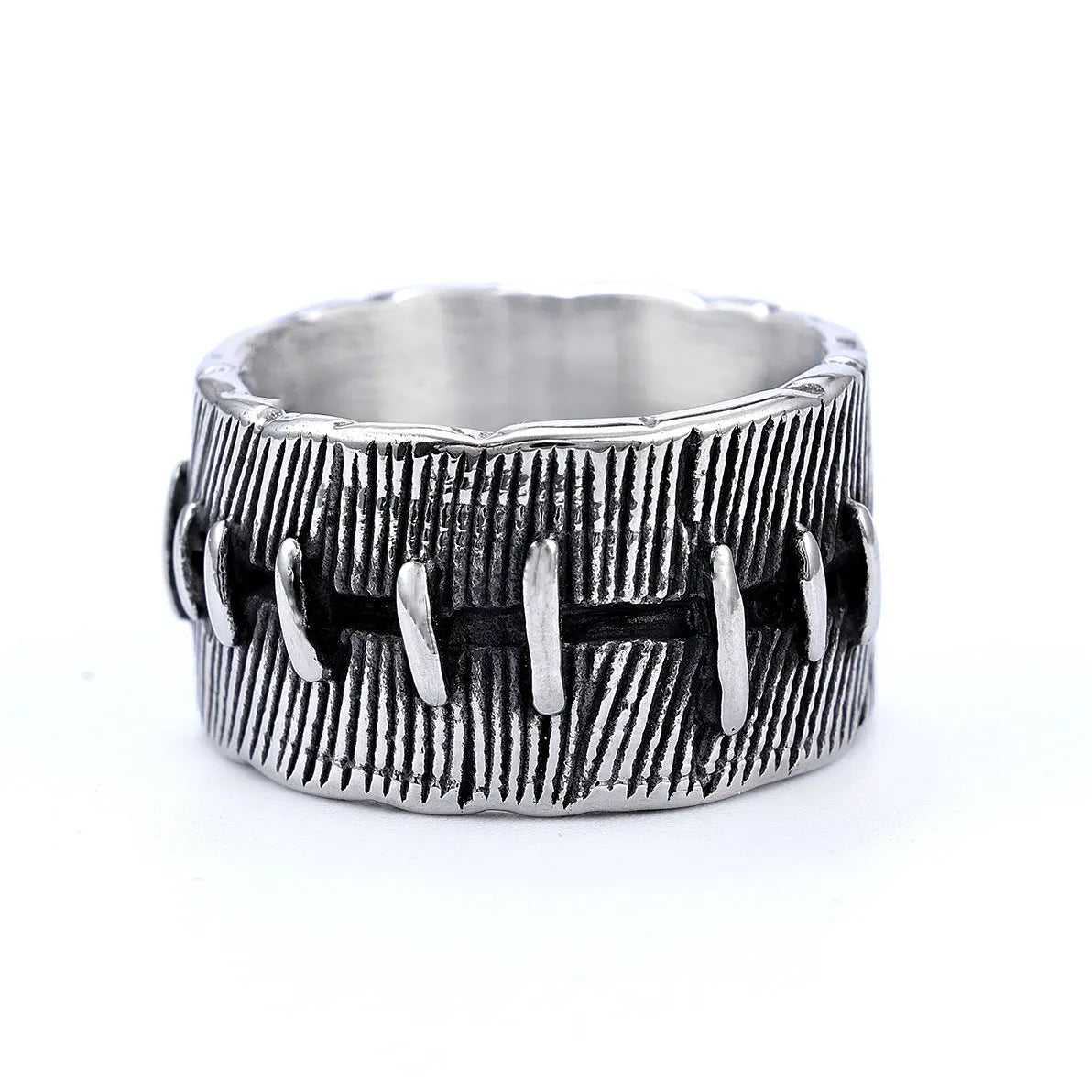 Geometric dark punk titanium steel double ring in retro colour on a black background.