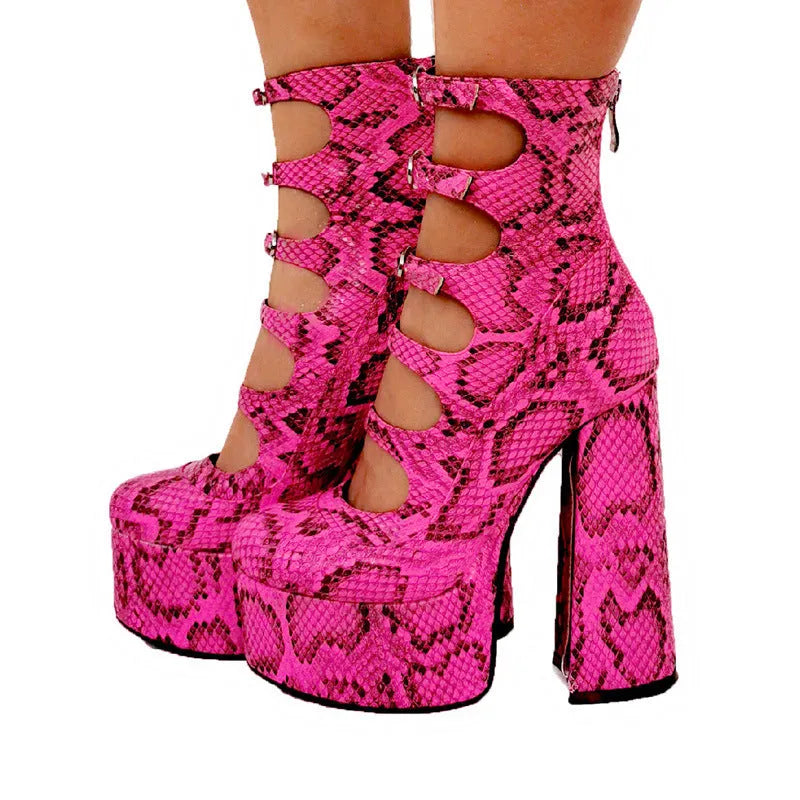 Women's black patent leather platform high heel boots with a thick heel, round toe, and serpentine ankle buckle.