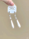Alloy geometric heart ear clip with rhinestones and a star tassel, shown in a light luxury fresh style.