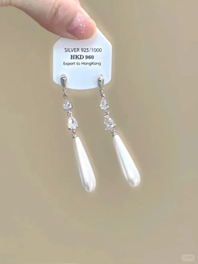 Alloy geometric heart ear clip with rhinestones and a star tassel, shown in a light luxury fresh style.
