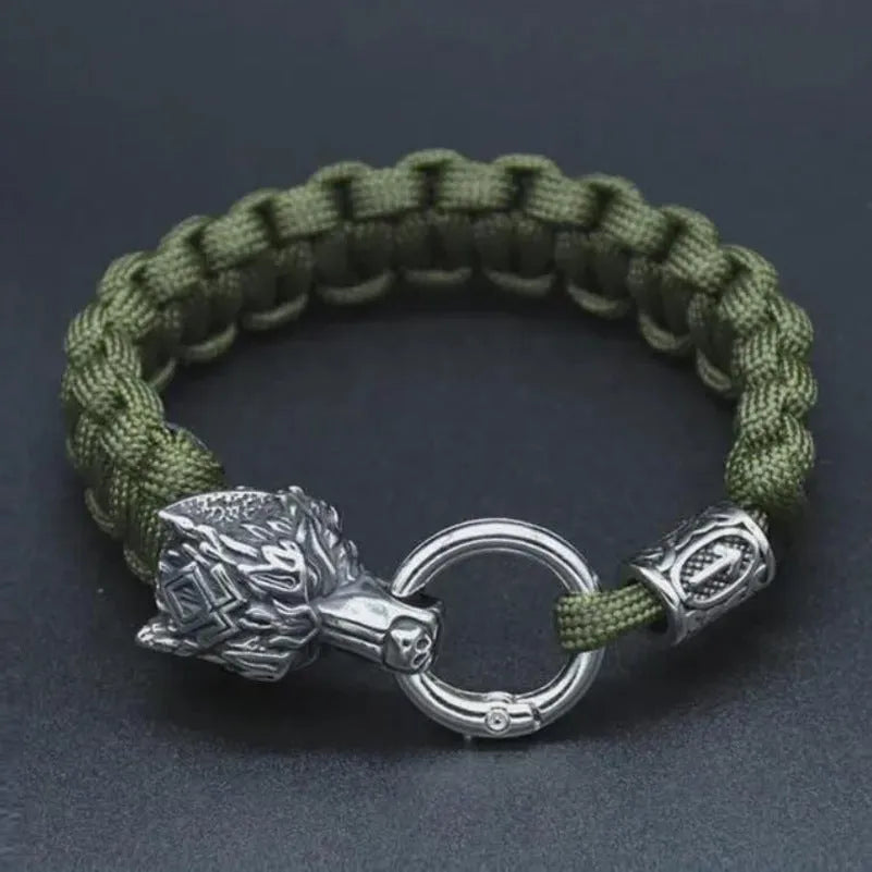Handmade titanium steel wolf head bracelet in camouflage colour on wrist.