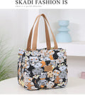 Women's printed canvas shoulder bag with aluminium frame in horizontal square shape