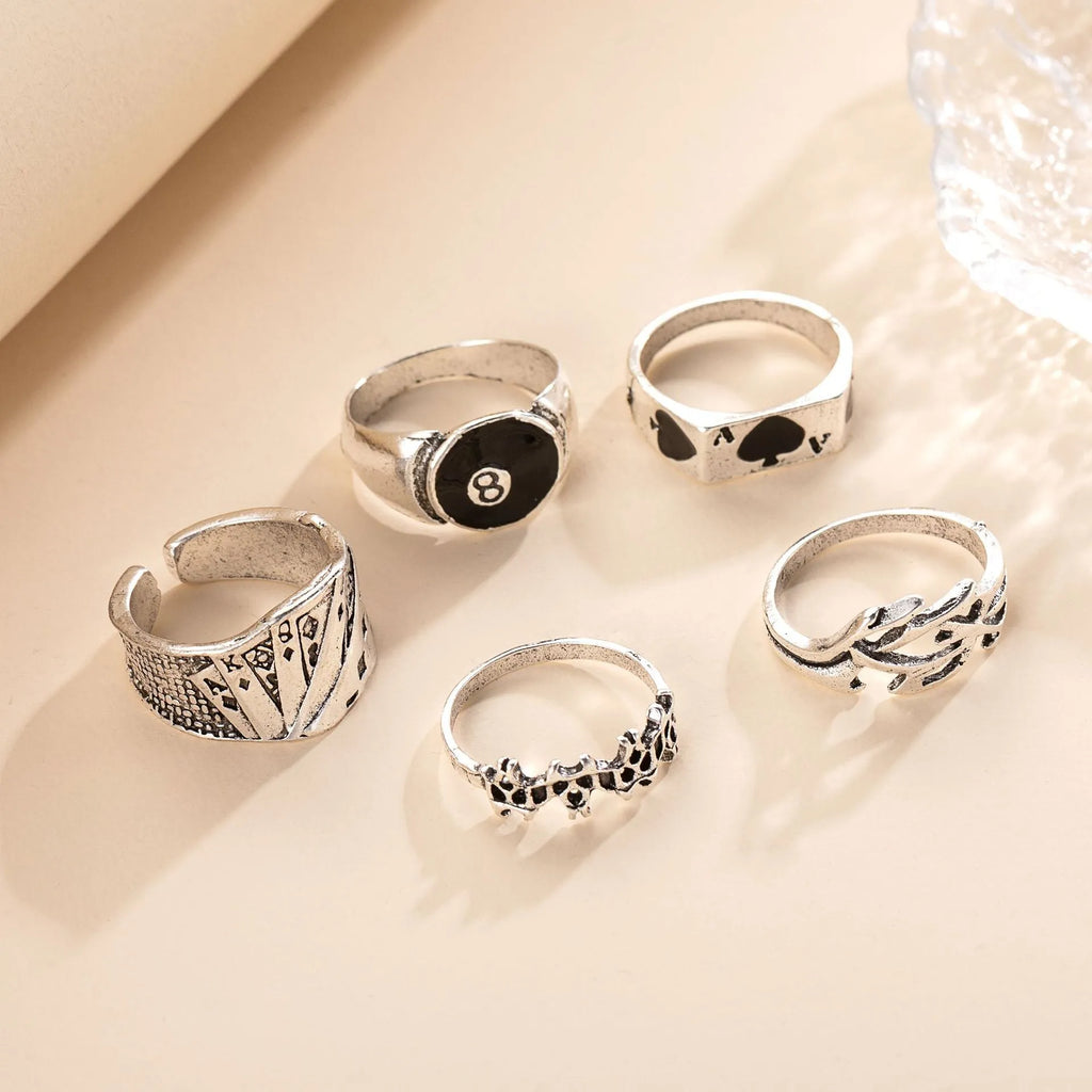 Black alloy ring with a raised retro spade card symbol and an adjustable band.
