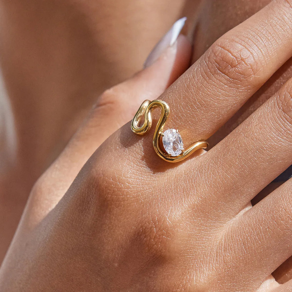 Geometric titanium steel zircon ring in a European American style on a plain background.