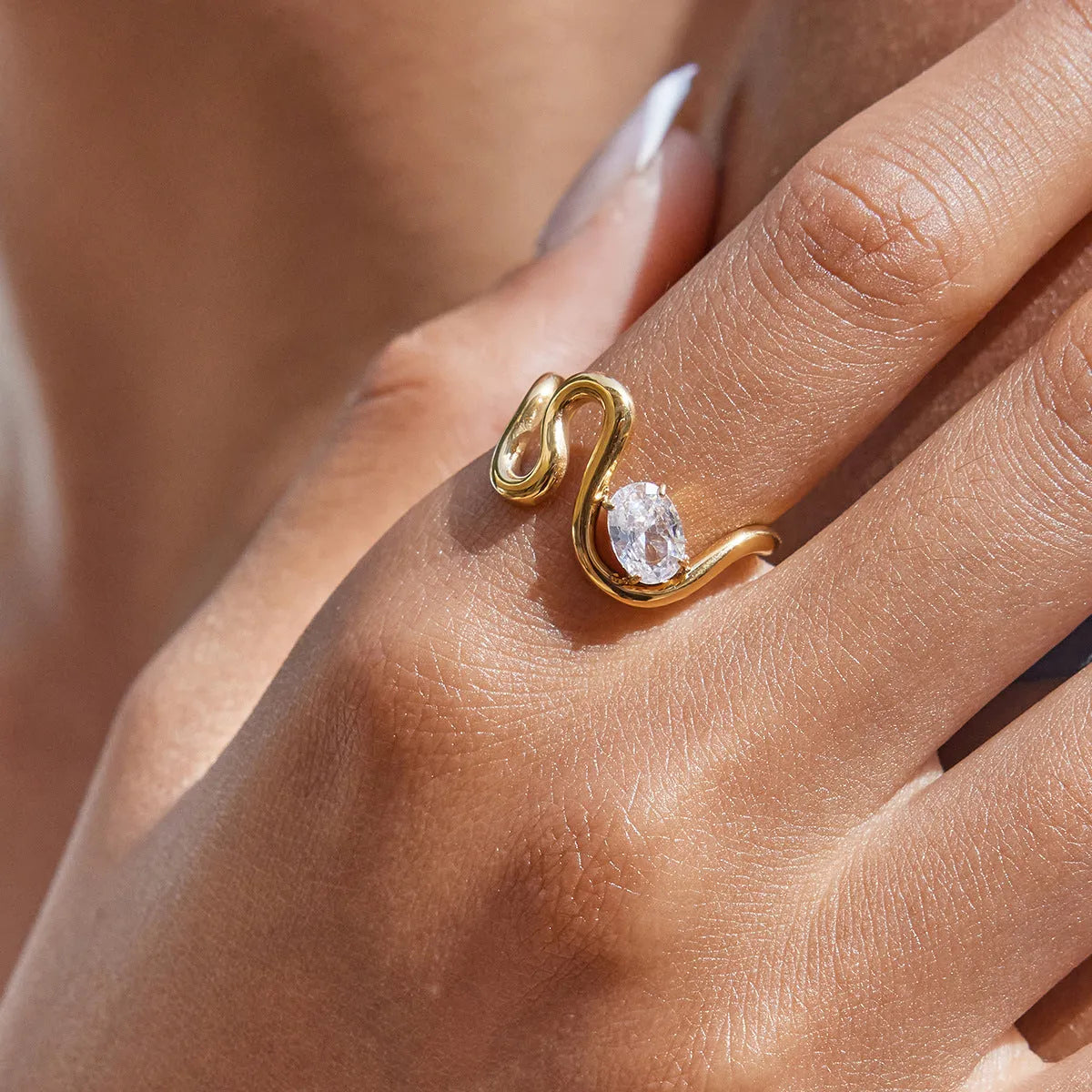 Geometric titanium steel zircon ring in a European American style on a plain background.