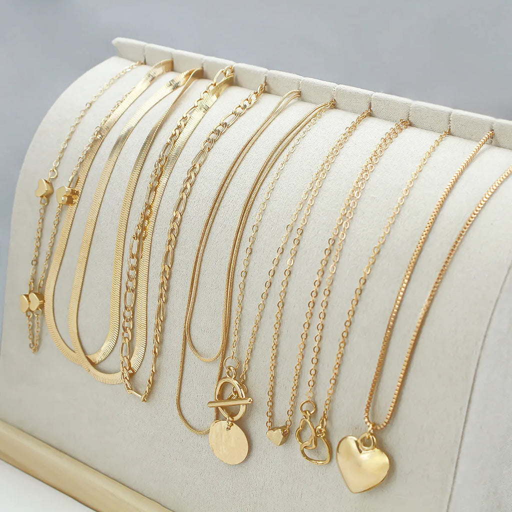 10 piece gold necklace set with snake bone chain and alloy pendants