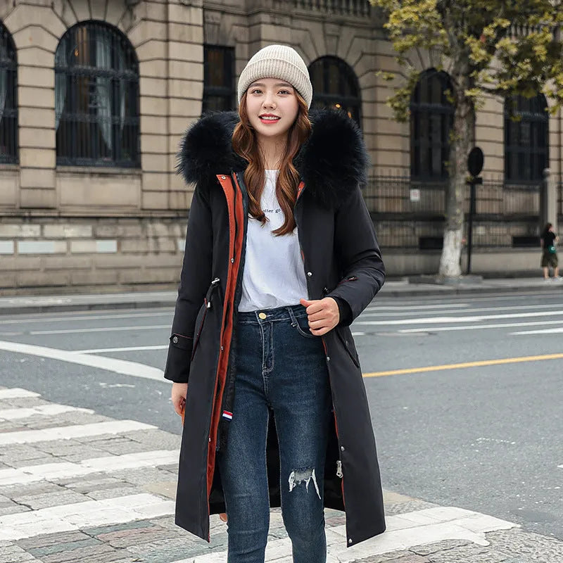 Women's long white cotton-padded fleece trench coat with down cotton filler, shown in elegant style.