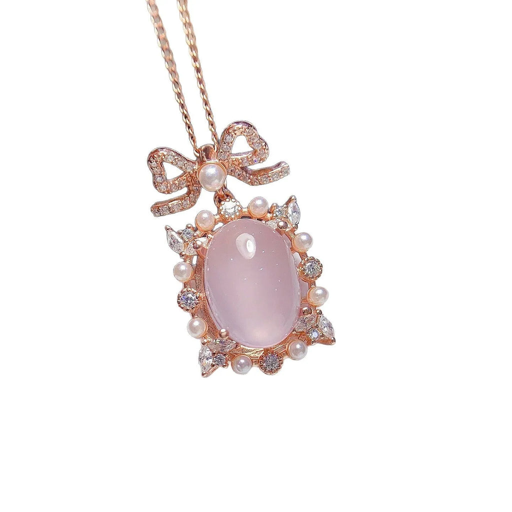 Geometric pendant necklace with pink rose quartz, silver chain, and rose gold plating