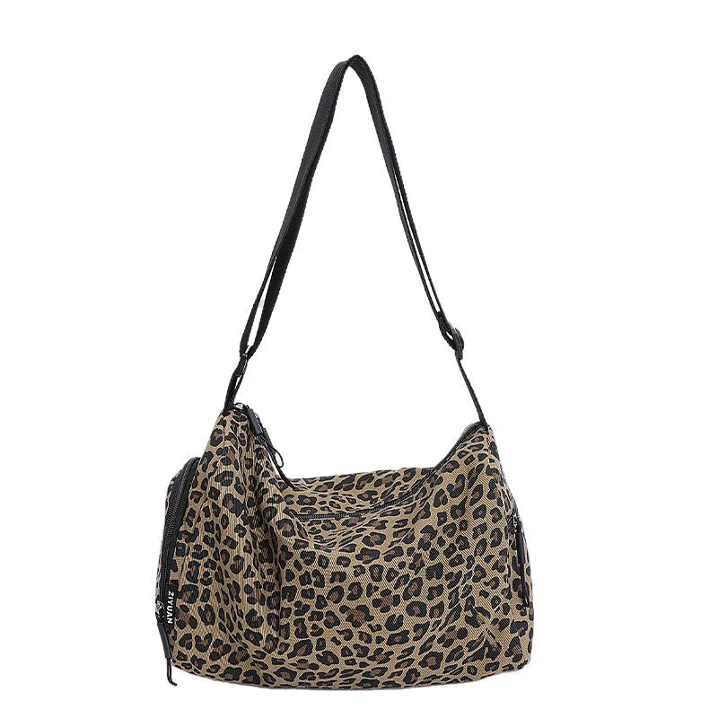 Leopard print sports style shoulder messenger bag with cross-body strap and stitching details
