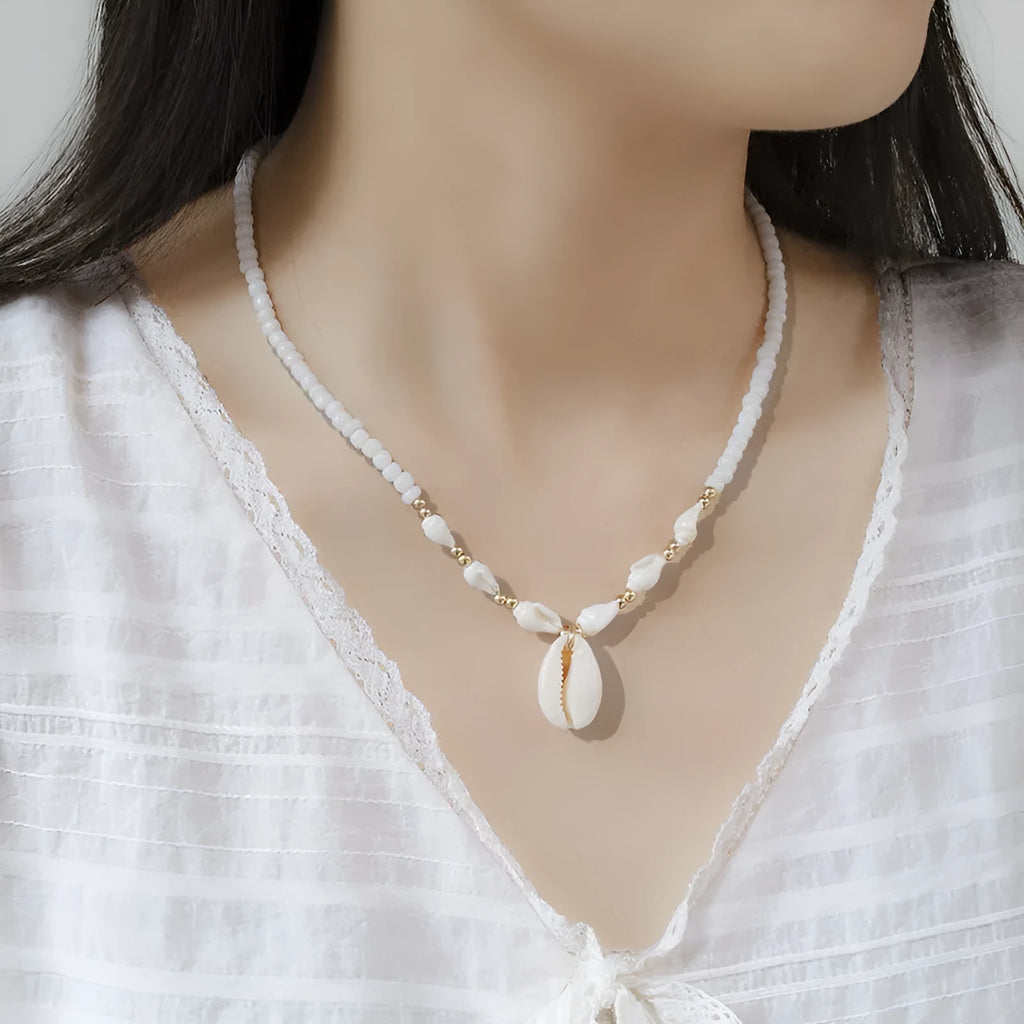 White Mother of Pearl conch shell necklace with regular chain on display
