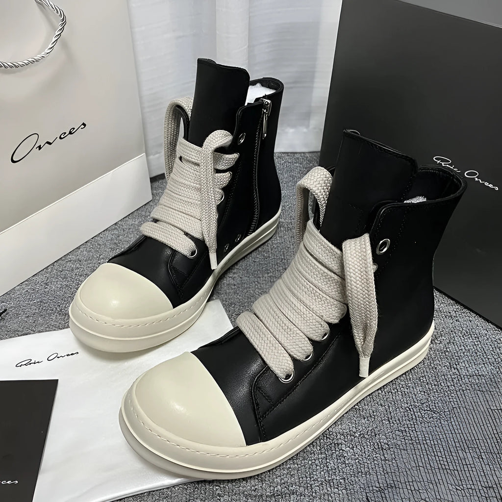 Black high-top leather boots with side zip and platform sole for men and women