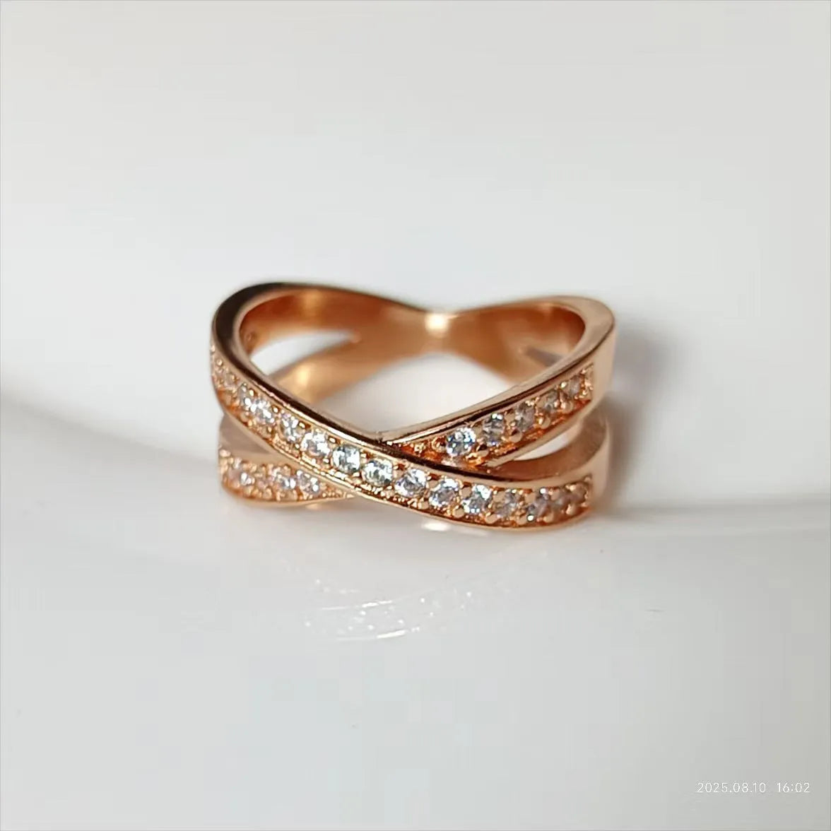 Silver or rose gold metal ring featuring a cross design with micro-inlaid zircon stones.