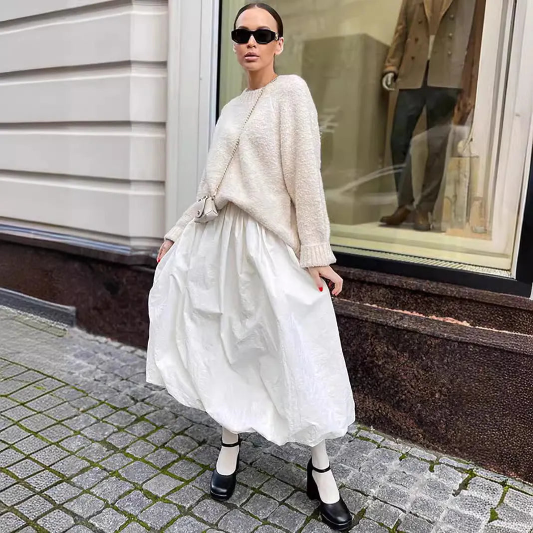 Women's long solid colour cotton skirt with elastic waist in black or white.