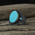 Men's antique silver alloy ring with round turquoise style design on finger