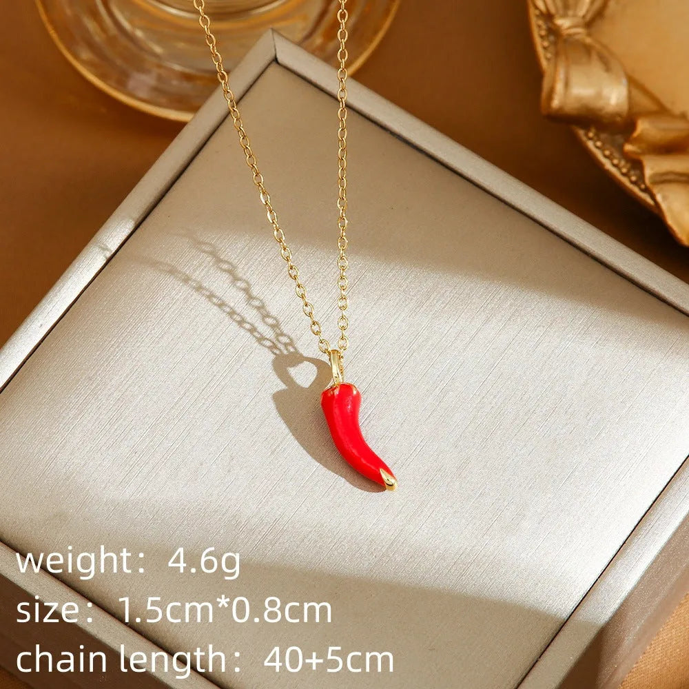 Delicate indie women's necklace with cherry, strawberry and pepper charms on a titanium steel O-ring chain.