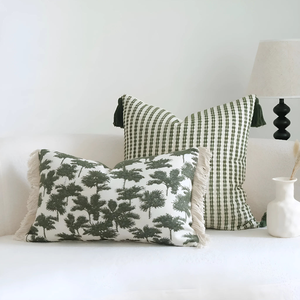 Green cotton linen hotel sample pillow with tassel detail in striped or leaf patterns