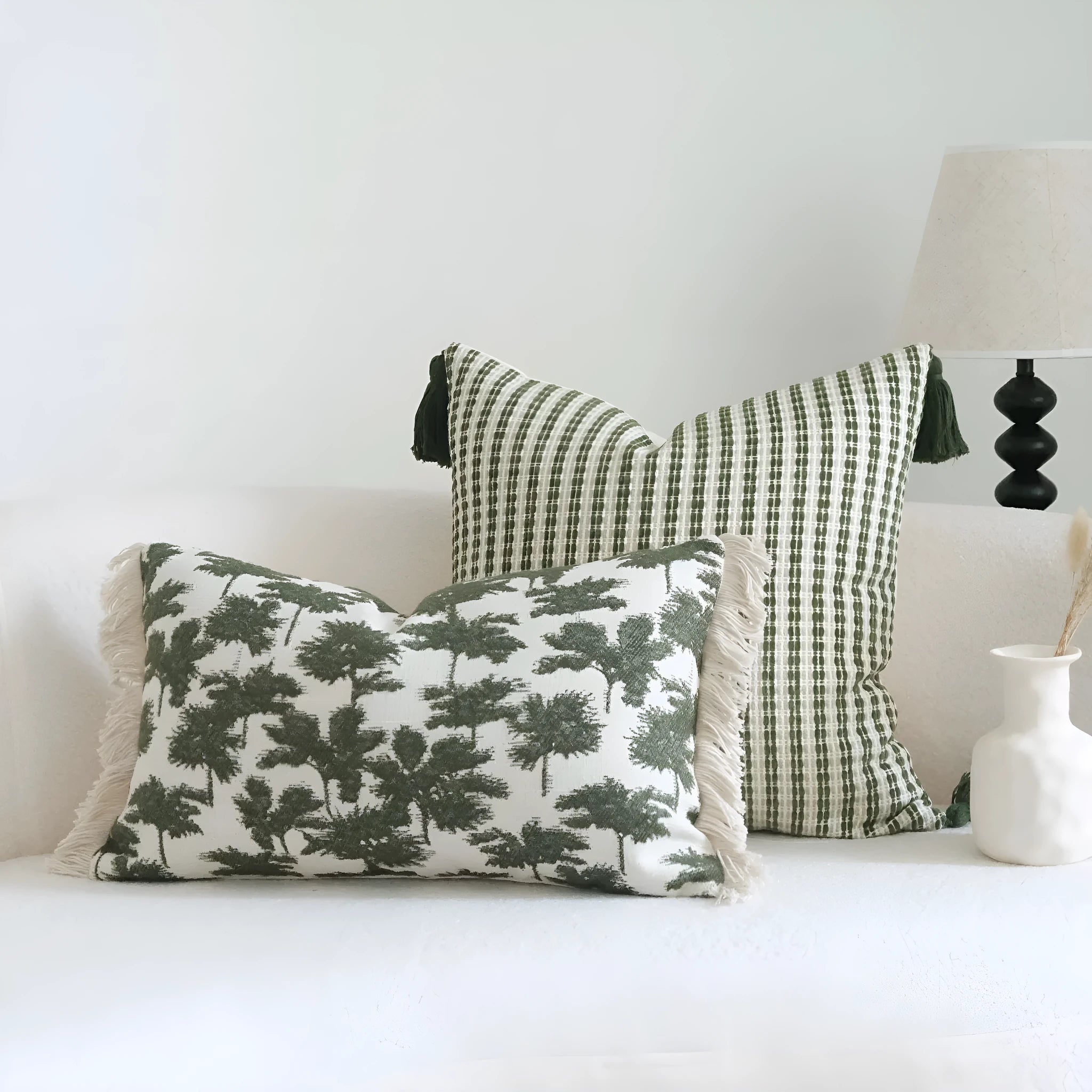 Green cotton linen hotel sample pillow with tassel detail in striped or leaf patterns
