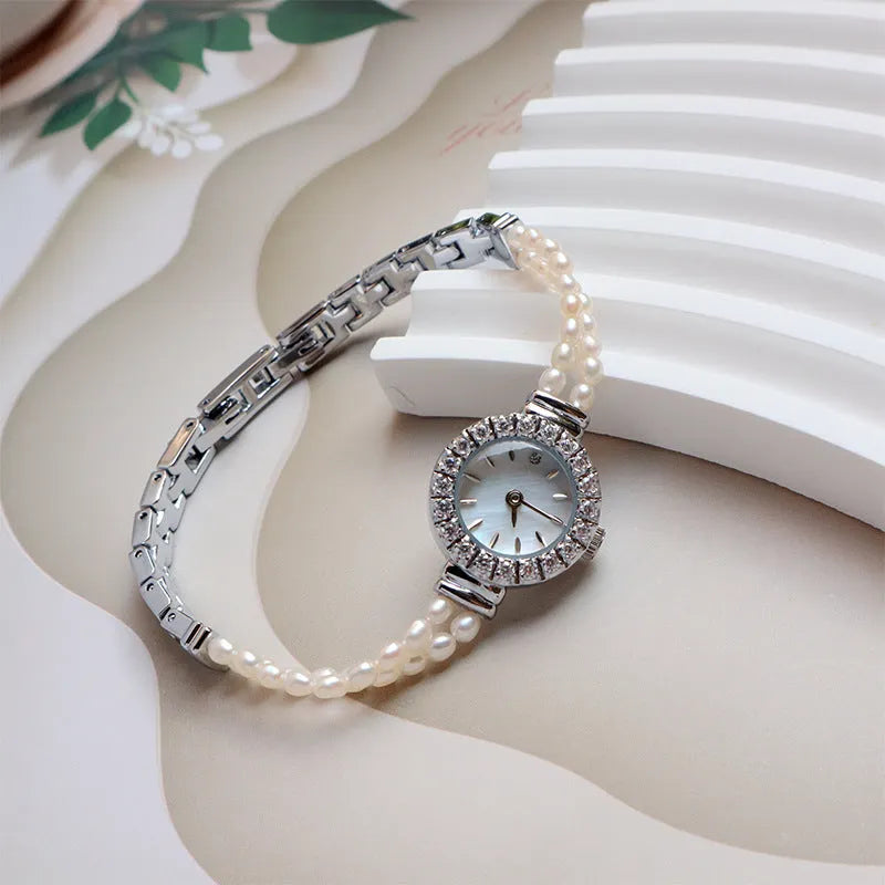 Women's light gold bracelet watch with natural freshwater pearls and round 18mm dial