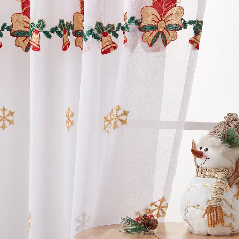 Pair of red and white Christmas curtains with embroidered snowflakes, showing semi-sunshade fabric.