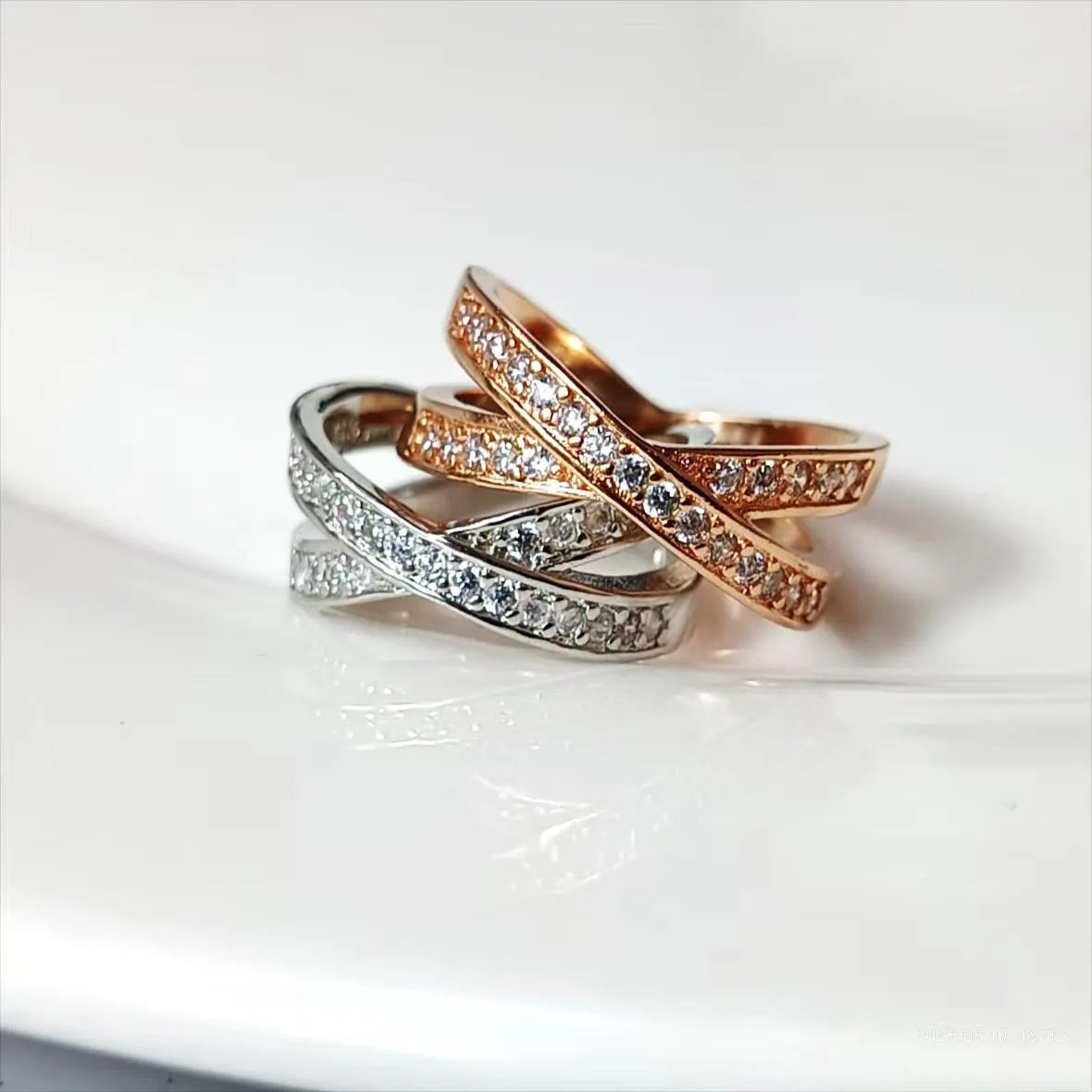 Silver or rose gold metal ring featuring a cross design with micro-inlaid zircon stones.