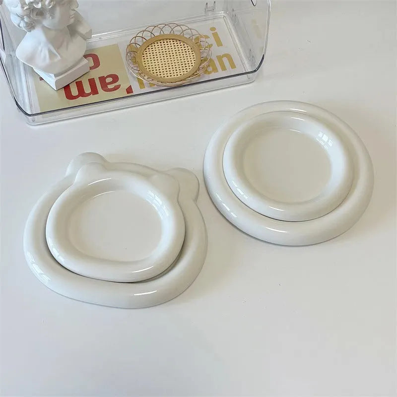 White porcelain plate with bear doodle or round doodle design, shown in 15cm and 20cm sizes.