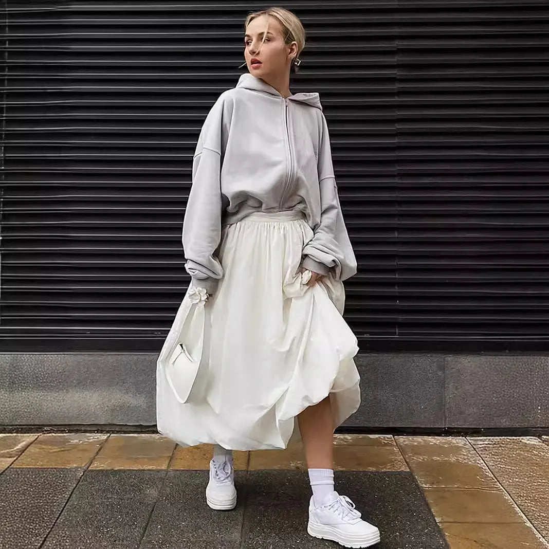 Women's long solid colour cotton skirt with elastic waist in black or white.