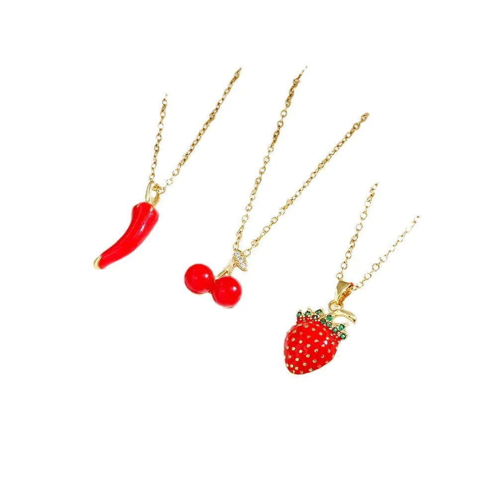 Delicate indie women's necklace with cherry, strawberry and pepper charms on a titanium steel O-ring chain.