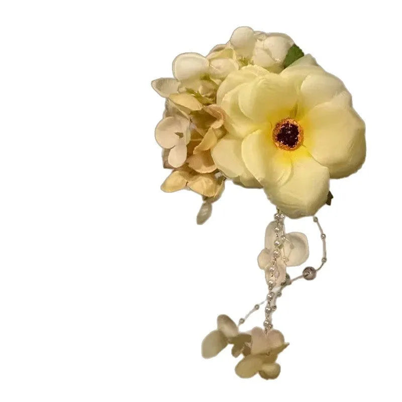 Handmade floral tassel hair clip with pearl detailing in purple or yellow colour option