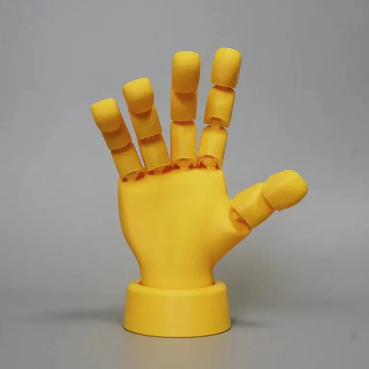 Yellow PLA plastic movable joint hand prop ornament with articulated fingers.