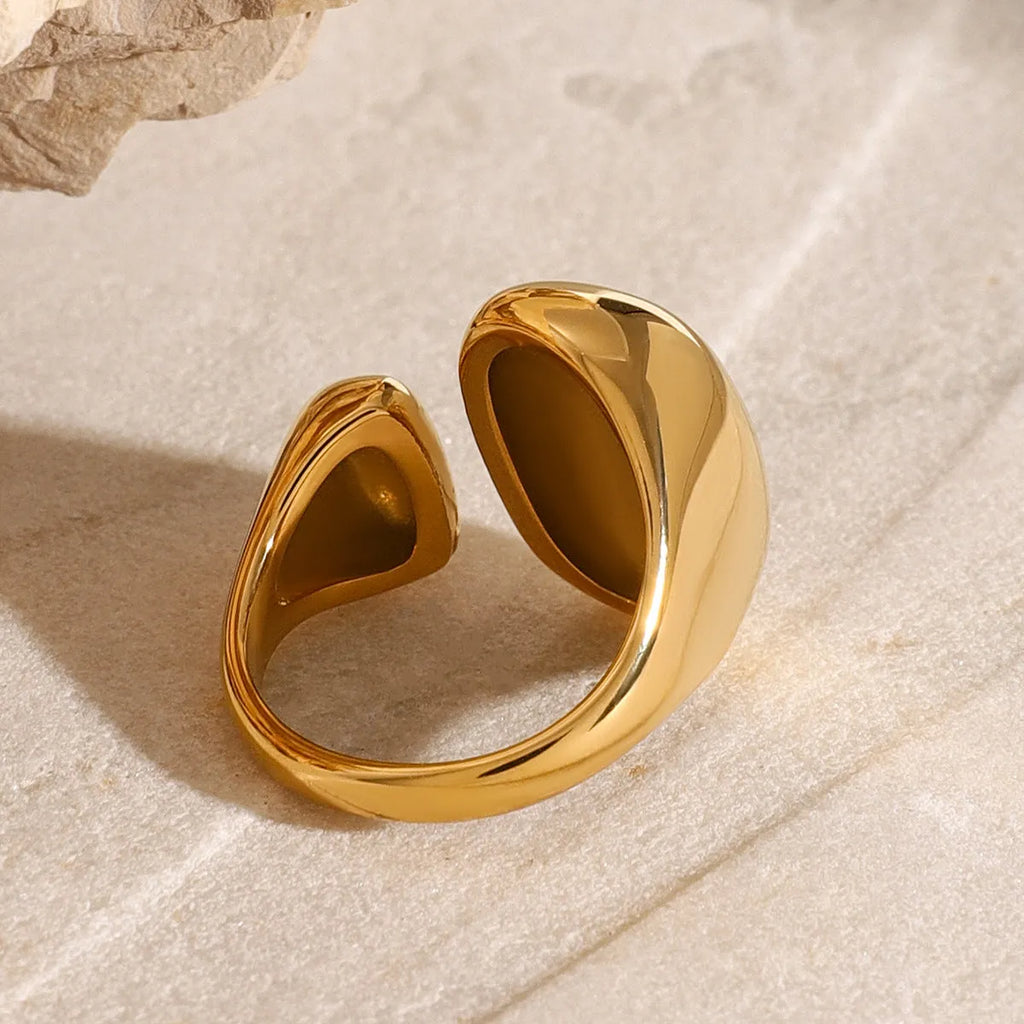 Women's exaggerated open geometric ring in stainless steel with electroplated finish.