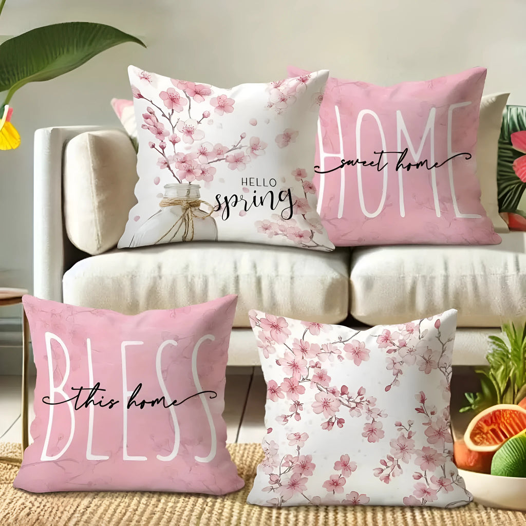 45cm square cherry blossom print cushion cover in short velvet fabric on a grey sofa.