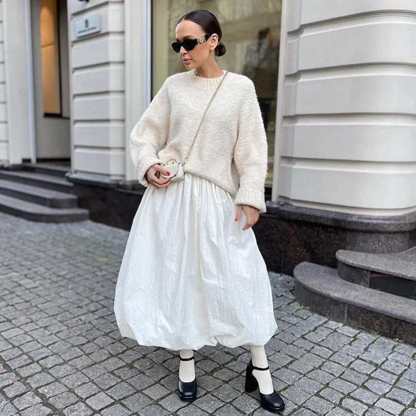 Women's long solid colour cotton skirt with elastic waist in black or white.